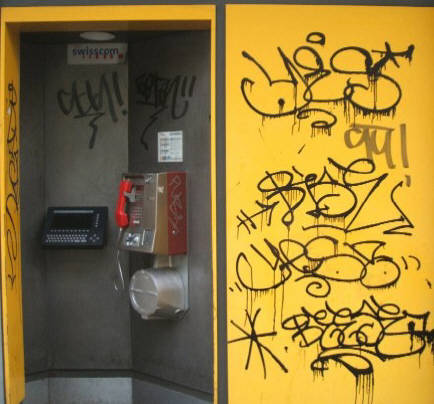 gepimpte Telefonzelle am Helvetiaplatz Zürich. pimped up phone booth full of graffiti tags in Zurich Switzerland.