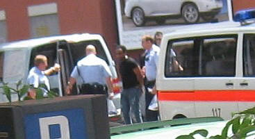 zurich metro squaq cops arrest black man on a sunday afternoon in june 2009. everyday scene in this town.